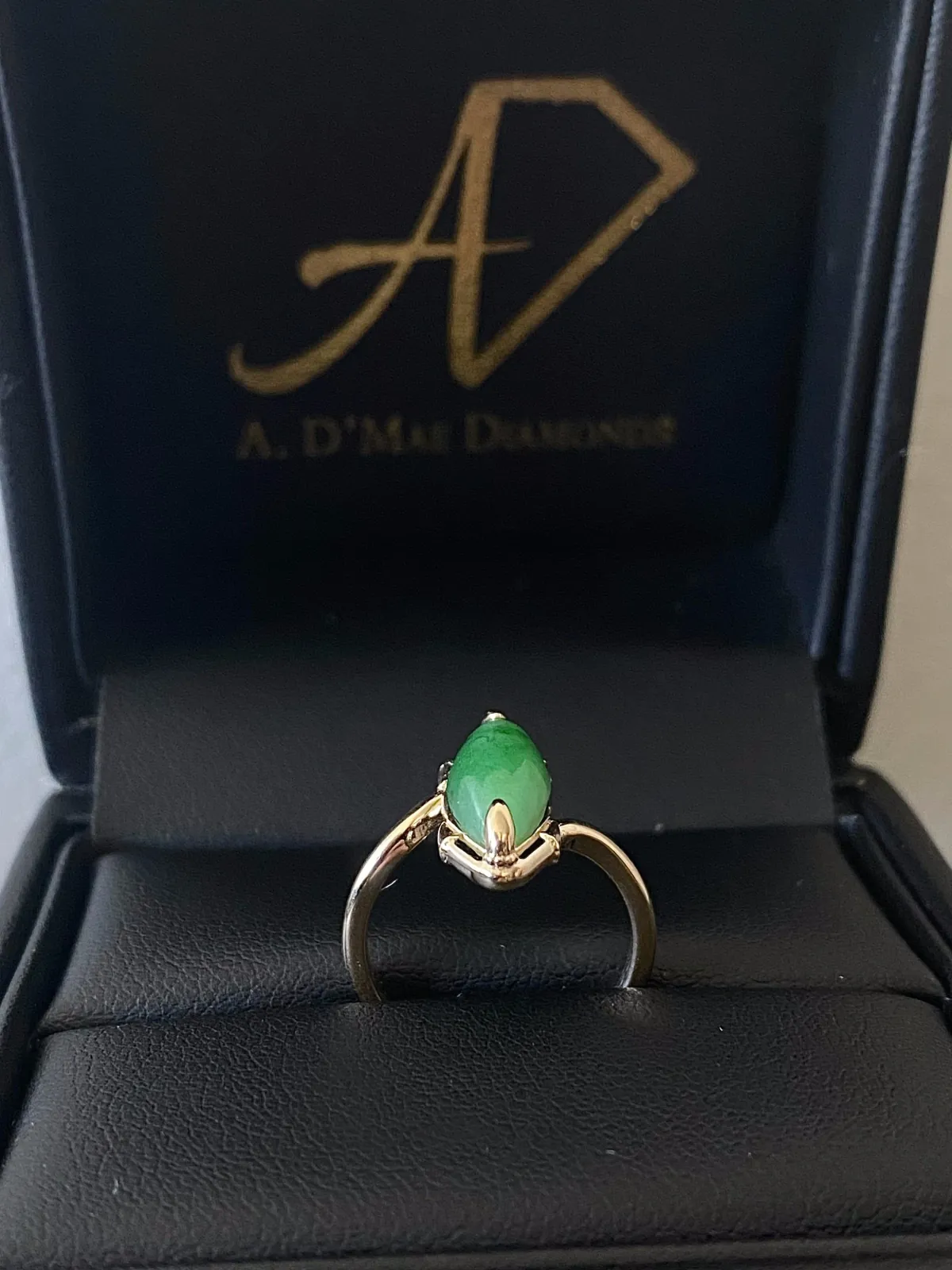 Finished custom jade raven claw engagement ring in A. D'Mae Diamonds presentation box, Los Angeles
