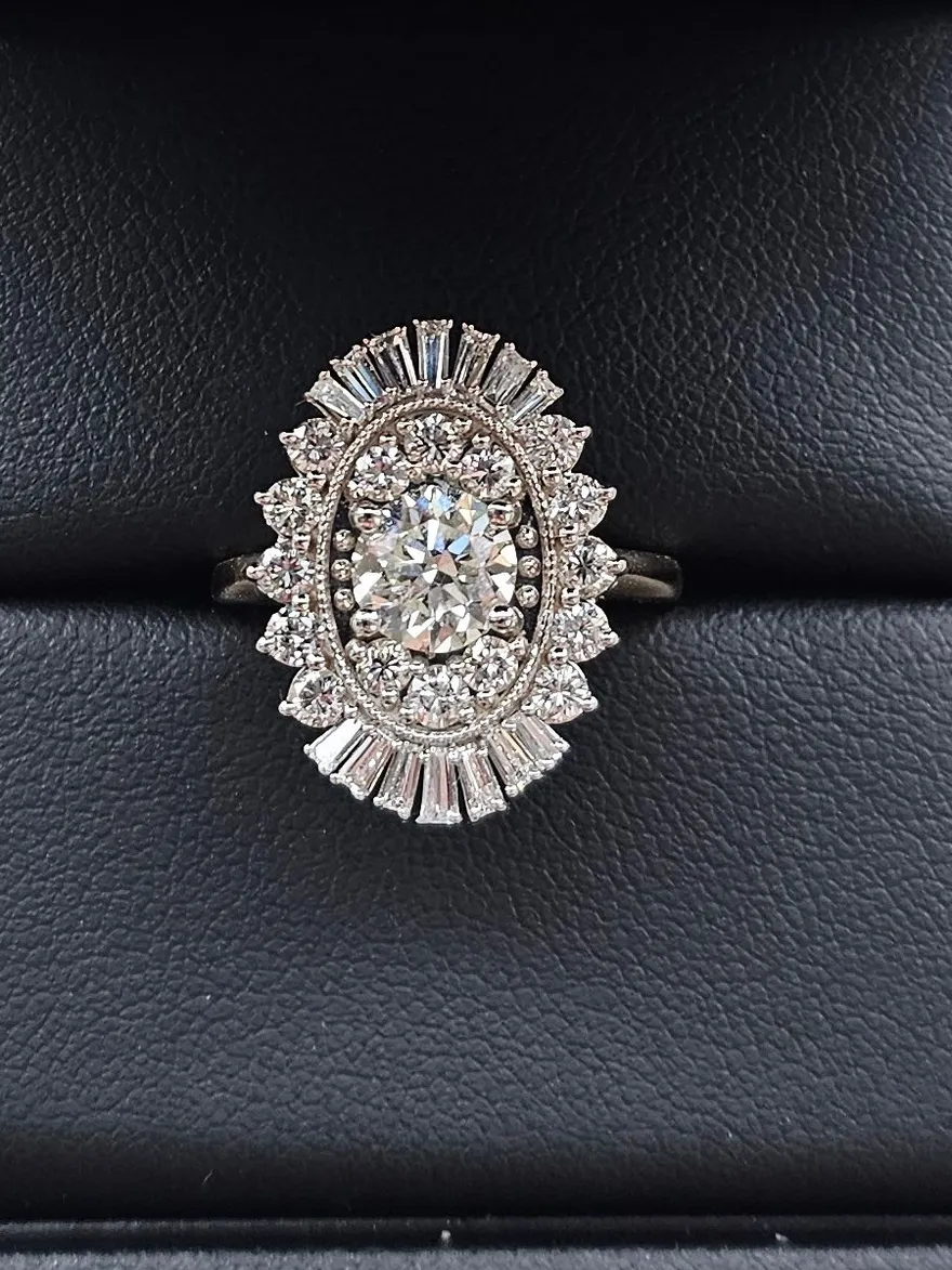 Heirloom diamond cluster engagement ring redesigned from three family rings in two-tone 14K yellow and white gold