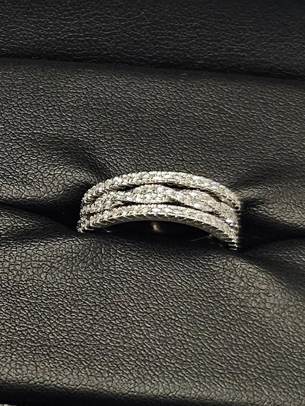 Three diamond wedding bands made to stack with the halo engagement ring