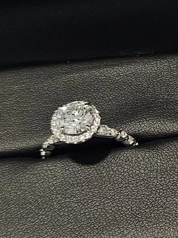 Upgrade: a family diamond set in a twenty-stone halo engagement ring