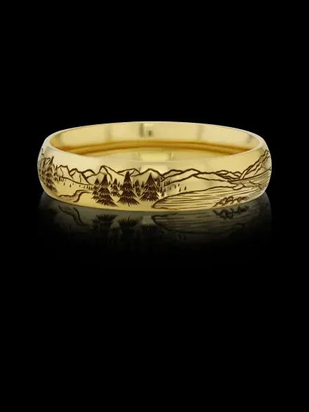 Custom men's wedding band in 14k gold with a hand-engraved landscape, designed by A. D'Mae Diamonds