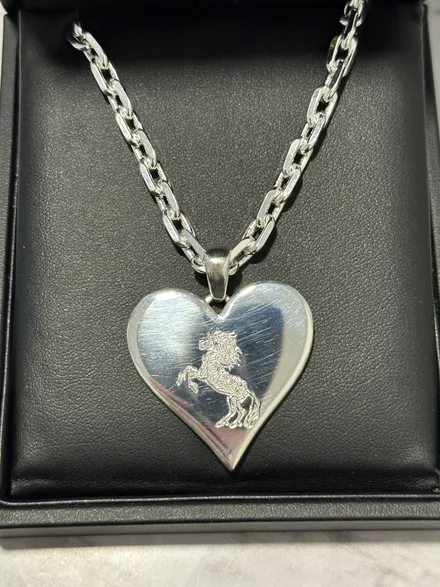 Custom hand-engraved silver heart pendant, designed by A. D'Mae Diamonds